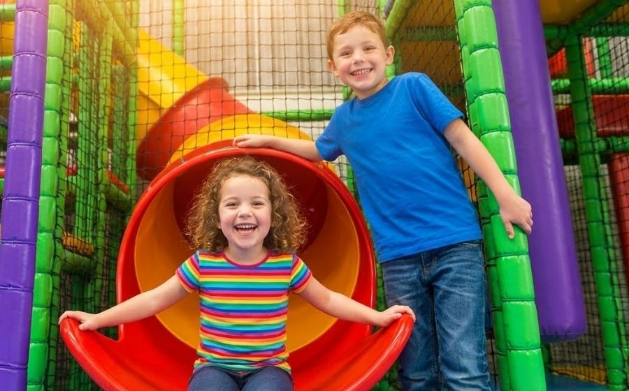 Two children play in the soft play at Monkey Tree Holiday Park