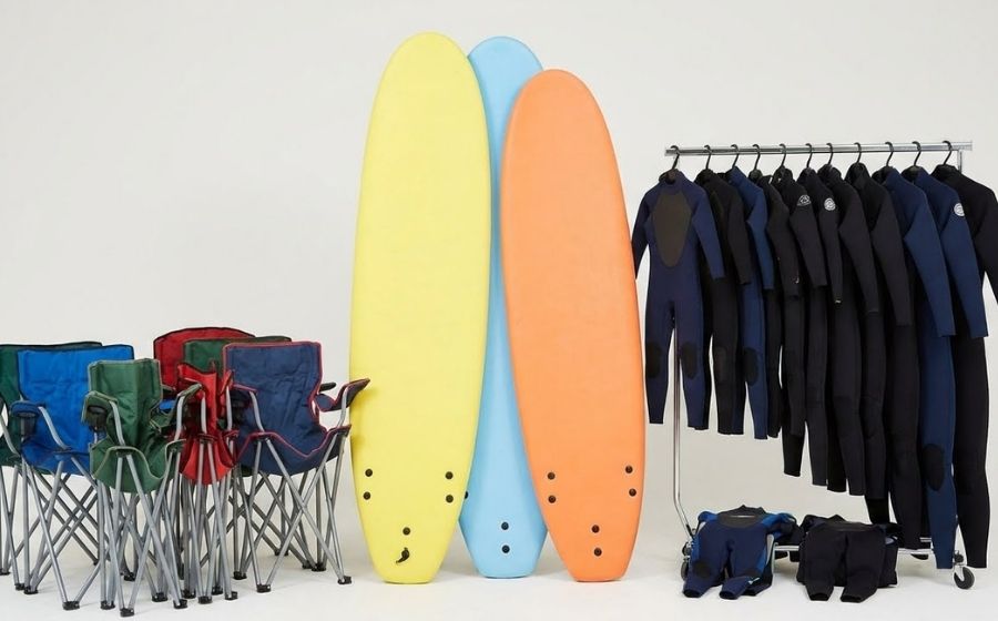 A selection of camping chairs, wetsuits and surfboards available to hire from the hire shop at monkey tree holiday park
